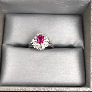 platinum with beautiful fushia red ruby with diamonds,  the real deal.